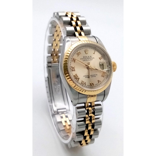 106 - A Rolex Oyster Perpetual Ladies Datejust Watch. Bi-metal (gold and steel) bracelet and case - 26mm. ... 