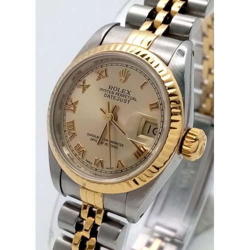 106 - A Rolex Oyster Perpetual Ladies Datejust Watch. Bi-metal (gold and steel) bracelet and case - 26mm. ... 