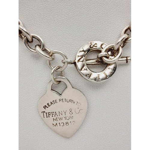 52 - A Classic Tiffany Sterling Silver Necklace with Hanging Heart Pendant. All the usual Tiffany marking... 