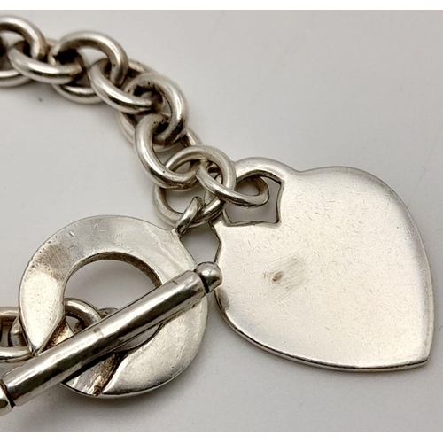 52 - A Classic Tiffany Sterling Silver Necklace with Hanging Heart Pendant. All the usual Tiffany marking... 