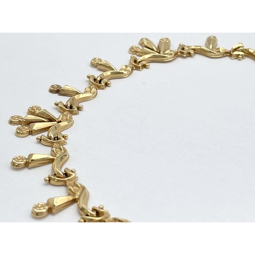 5 - AN 18K GOLD DESIGNER NECKLACE BASED ON THE 