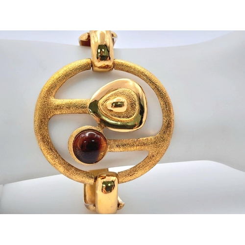 101 - A superb, modernist, vintage, PIERRE CARDIN, PARIS, abstract, gold tone bracelet in its original pre... 