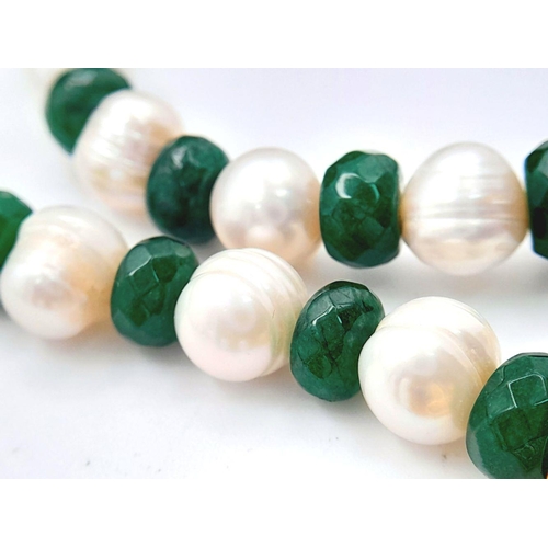 115 - A very glamorous green jade and natural cultured pearl necklace, bracelet and earrings set with gold... 