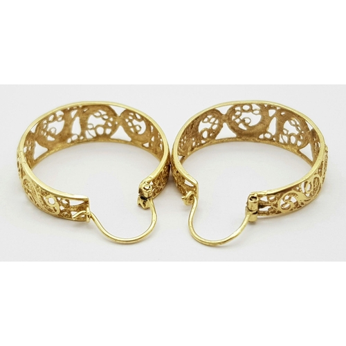 38 - A Pair of 9K Yellow Gold Hoop Earrings. Pierced decoration. 
25mm diameter. 4.6g total weight.