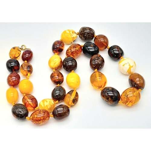 44 - A Vintage Amber Necklace. Honey, white butterscotch and Red Beads create this amber masterpiece. 62c... 