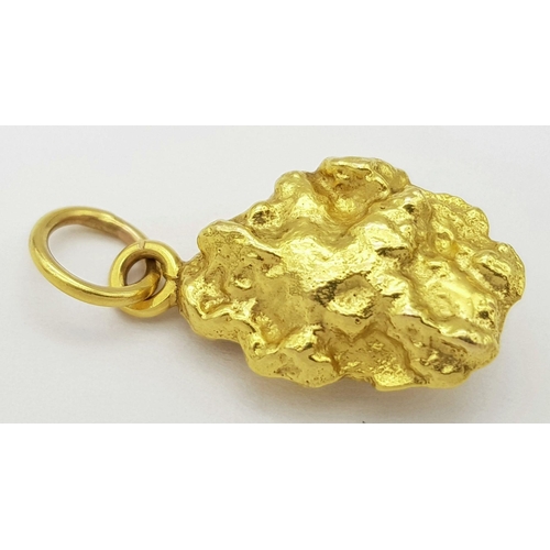 45 - An Australian Gold Nugget Pendant. Tests as at least 22K. 11.2g weight.