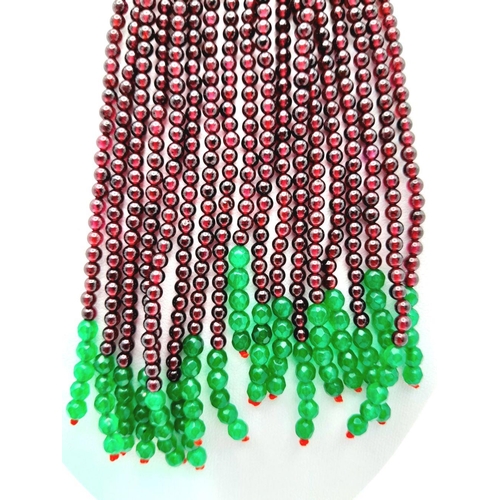 73 - A statement multi gem necklace consisting of eleven strands with a spectacular central floral pendan... 