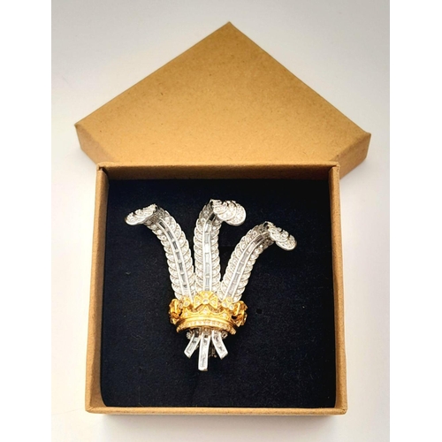 87 - A replica of the “Prince of Wales Brooch”.
Dimensions: 5 x 4 cm. Accompanied by two framed printed i... 