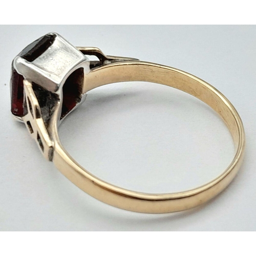 126 - An appealing 9 carat GOLD RING having a red  Emerald cut Carnelian coloured Gemstone set to top and ... 