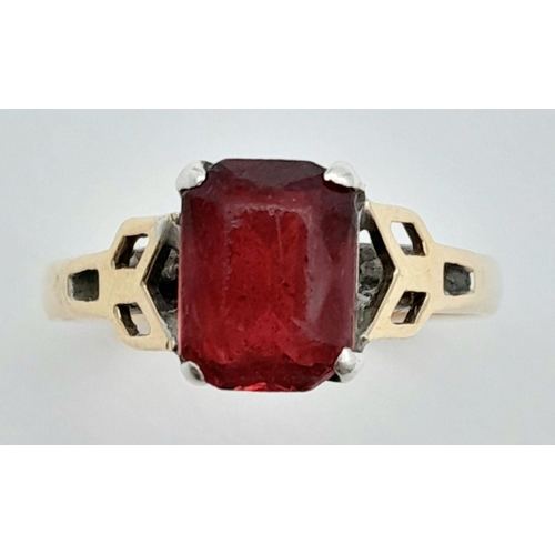 126 - An appealing 9 carat GOLD RING having a red  Emerald cut Carnelian coloured Gemstone set to top and ... 