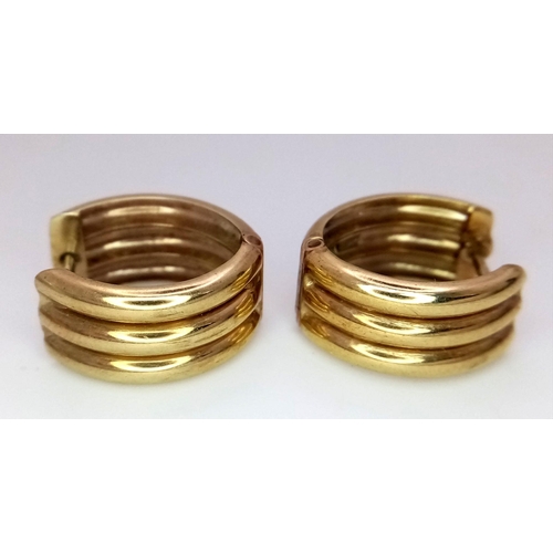 133 - An elegant pair of 9 CARAT GOLD EARRINGS. Triple hoop. Fully hallmarked. Presented in jewellers earr... 