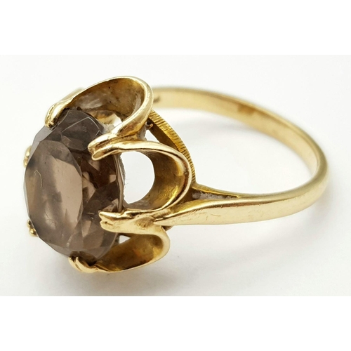 14 - Impressive 9 carat GOLD RING set with large (2.5 carat) Oval cut  BROWN AMETHYST. Attractive six cla... 