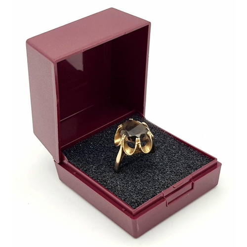 14 - Impressive 9 carat GOLD RING set with large (2.5 carat) Oval cut  BROWN AMETHYST. Attractive six cla... 