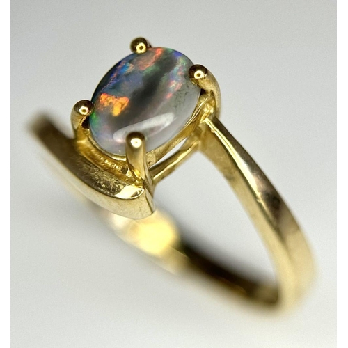 175 - Attractive 9 carat GOLD and OPAL RING. Having Oval BLUE OPAL set to top in Stylish crossover mount. ... 