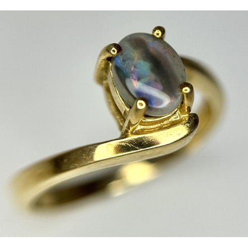 175 - Attractive 9 carat GOLD and OPAL RING. Having Oval BLUE OPAL set to top in Stylish crossover mount. ... 