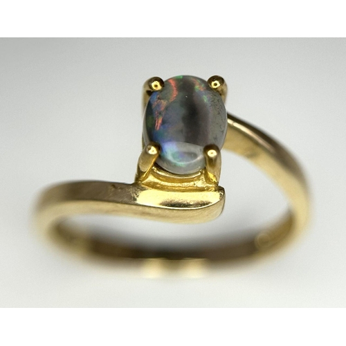 175 - Attractive 9 carat GOLD and OPAL RING. Having Oval BLUE OPAL set to top in Stylish crossover mount. ... 