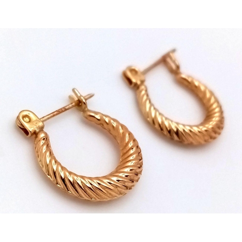 245 - Elegant pair of 14 carat GOLD HOOP EARRINGS. 1.4 cm diameter. 0.7 grams.