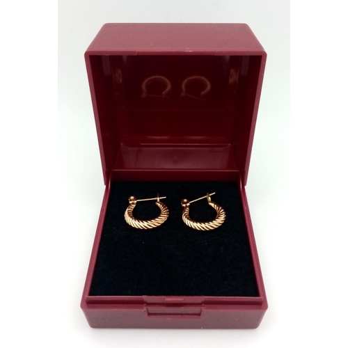 245 - Elegant pair of 14 carat GOLD HOOP EARRINGS. 1.4 cm diameter. 0.7 grams.