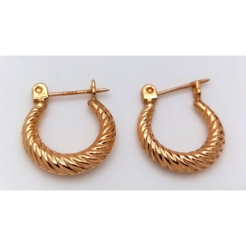 245 - Elegant pair of 14 carat GOLD HOOP EARRINGS. 1.4 cm diameter. 0.7 grams.