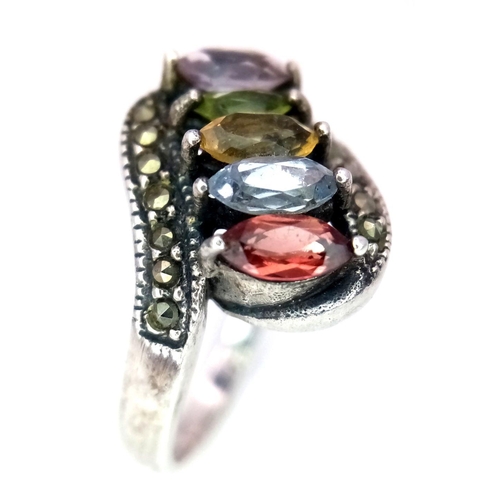 252 - Vintage SILVER MARCASITE RING. Set with various gemstones to include Tanzanite. Complete with jewell... 