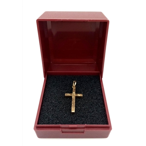 273 - Vintage dainty hallmarked 9 carat  GOLD CROSS. Beautifully decorated to top. 1.3 grams. 2.5 x 1.2 cm... 