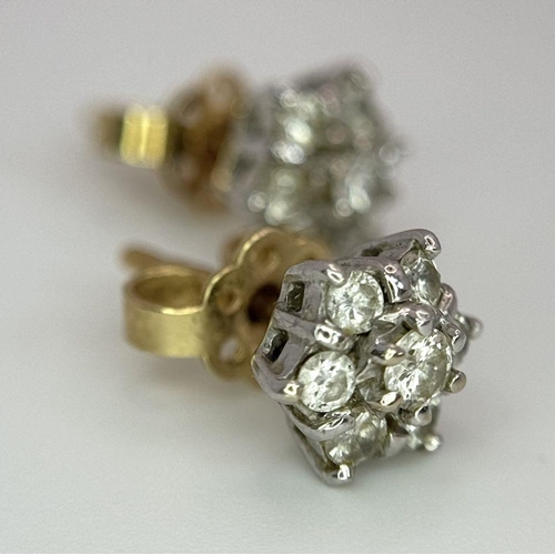 63 - A magnificent pair of 18 carat GOLD , DIAMOND EARRINGS. Each earring set with 7 x  high quality DIAM... 