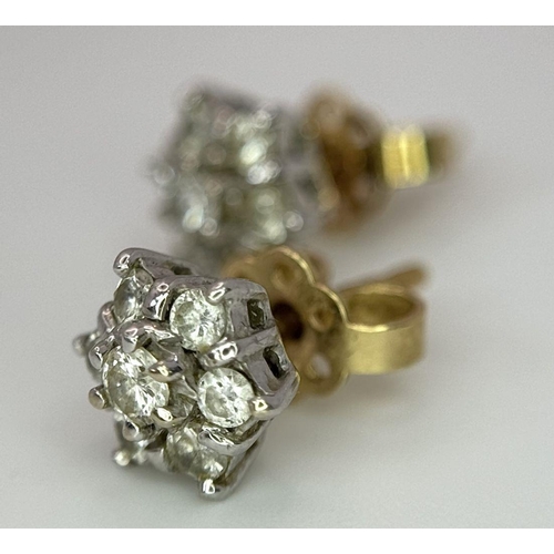 63 - A magnificent pair of 18 carat GOLD , DIAMOND EARRINGS. Each earring set with 7 x  high quality DIAM... 