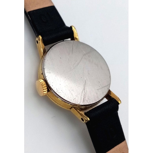 50 - A Vintage Omega Ladies Watch. Black leather strap. Gilded case - 20mm. Slight patinaed dial. Manuel ... 