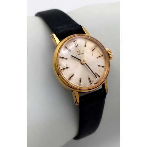 50 - A Vintage Omega Ladies Watch. Black leather strap. Gilded case - 20mm. Slight patinaed dial. Manuel ... 