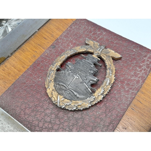 55 - Kriegsmarine Memorial Desk Set. The High Seas Badge indicates he served on Battleships and Cruisers.... 