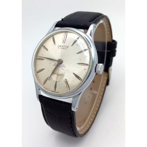 57 - A Vintage Orator 21 Jewels Gents Watch. Black leather strap. 
Stainless steel case - 37mm. Silver to... 