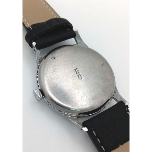 57 - A Vintage Orator 21 Jewels Gents Watch. Black leather strap. 
Stainless steel case - 37mm. Silver to... 