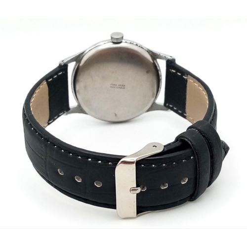 57 - A Vintage Orator 21 Jewels Gents Watch. Black leather strap. 
Stainless steel case - 37mm. Silver to... 