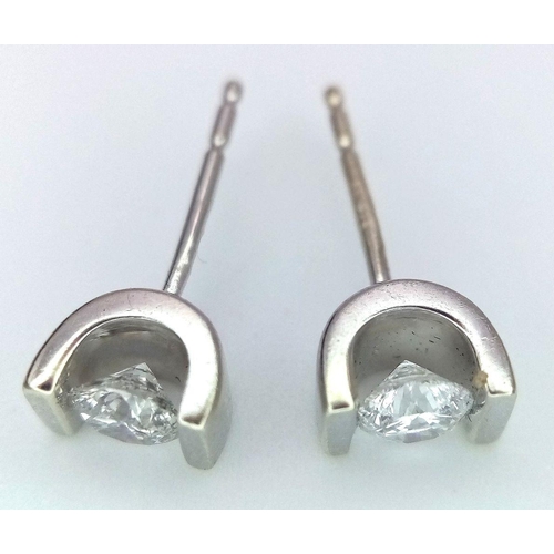 131 - A 9K WHITE GOLD DIAMOND STUD EARRINGS. 
 0.50CT 1.7G , NEED BUTTERFLY BACKS.

ref: SC 1060