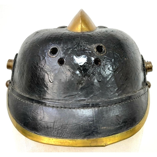 132 - Unusual Imperial German Fire Helmet. A standard 1915 Pattern Army Pickelhaube Marked to the 19th Inf... 