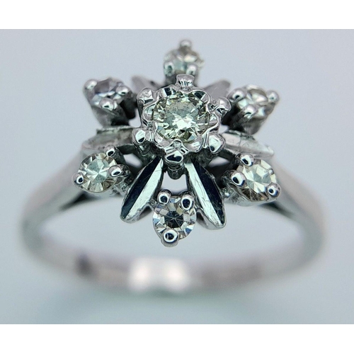 137 - AN 18K WHITE GOLD DIAMOND CLUSTER RING 3.8G  TOTAL WEIGHT, SIZE N.

ref: SC 1102