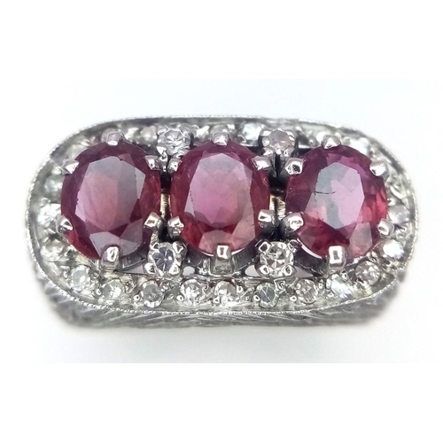 19 - A 14K WHITE GOLD DIAMOND & RUBY RING.  3 X OVAL RUBIES, TOTAL 1.50CT. Size J 1/2 , 8.5G TOTAL WEIGHT... 