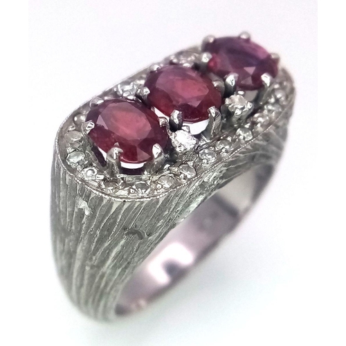 19 - A 14K WHITE GOLD DIAMOND & RUBY RING.  3 X OVAL RUBIES, TOTAL 1.50CT. Size J 1/2 , 8.5G TOTAL WEIGHT... 