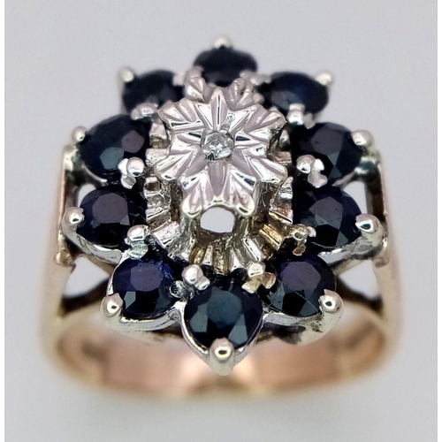 243 - A 9K YELLOW GOLD DIAMOND & SAPPHIRE VINTAGE RING, IN THE FLORAL DESIGN. 5G SIZE I 1/2.

ref: SC 1003