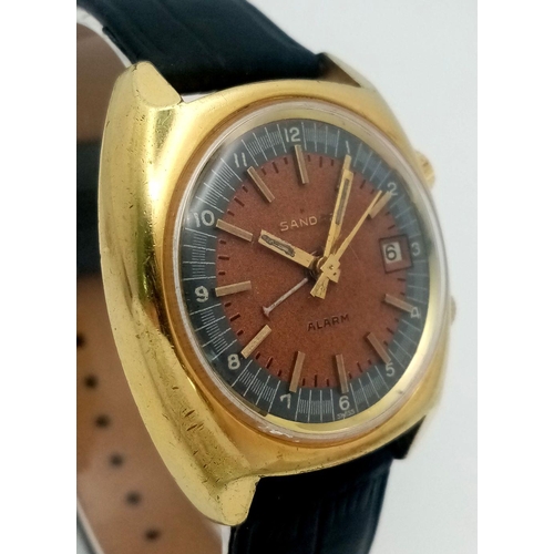 254 - A Rare Vintage Sandoz Alarm Gents Watch. Black leather strap. Gilded case - 35mm. Brown dial with da... 