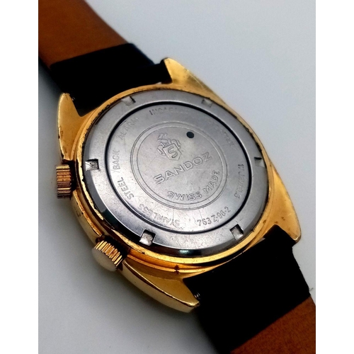 254 - A Rare Vintage Sandoz Alarm Gents Watch. Black leather strap. Gilded case - 35mm. Brown dial with da... 