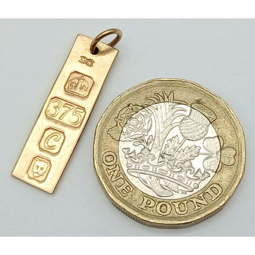 268 - A MINI INGOT PENDANT IN 9K GOLD .    2.4gms   2.5cms drop