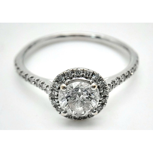 11 - AN 18K WHITE GOLD DIAMOND HALO SOLITAIRE RING 0.75CT MAIN STONE ROUND BRILIANT AND 0.25CT OF HALO & ... 