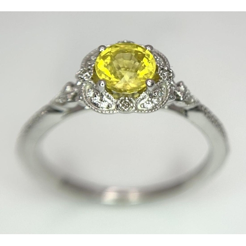 127 - A 9K WHITE GOLD DIAMOND & YELLOW SAPPHIRE RING 2.1G SIZE M.

ref: SC 1011