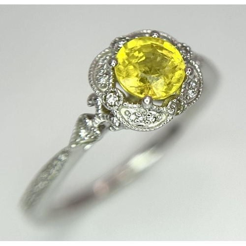 127 - A 9K WHITE GOLD DIAMOND & YELLOW SAPPHIRE RING 2.1G SIZE M.

ref: SC 1011