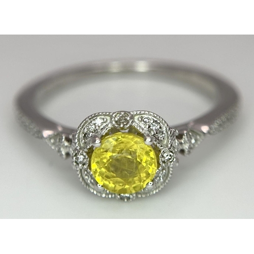 127 - A 9K WHITE GOLD DIAMOND & YELLOW SAPPHIRE RING 2.1G SIZE M.

ref: SC 1011