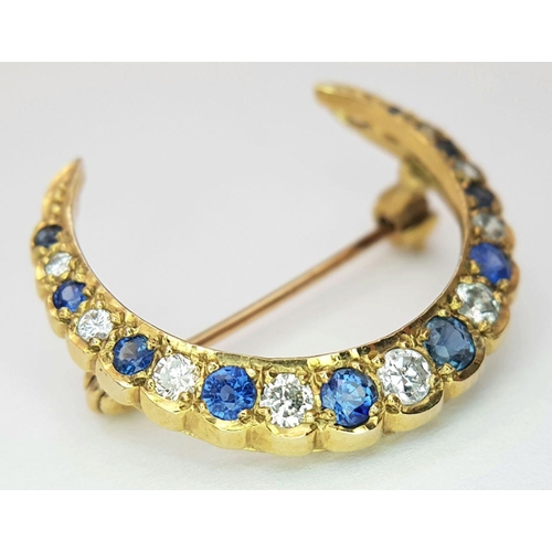 285 - A 9K YELLOW GOLD DIAMOND & SAPPHIRE HALF MOON BROOCH. 3.1G , APPROX 22MM X 25MM.

REF: SC 1019