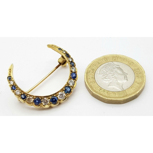 285 - A 9K YELLOW GOLD DIAMOND & SAPPHIRE HALF MOON BROOCH. 3.1G , APPROX 22MM X 25MM.

REF: SC 1019