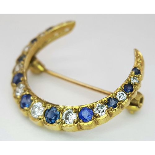 285 - A 9K YELLOW GOLD DIAMOND & SAPPHIRE HALF MOON BROOCH. 3.1G , APPROX 22MM X 25MM.

REF: SC 1019