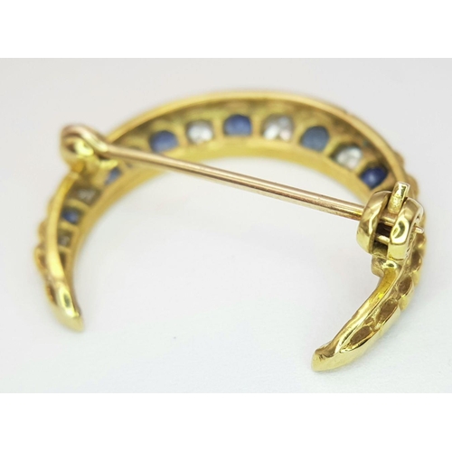 285 - A 9K YELLOW GOLD DIAMOND & SAPPHIRE HALF MOON BROOCH. 3.1G , APPROX 22MM X 25MM.

REF: SC 1019